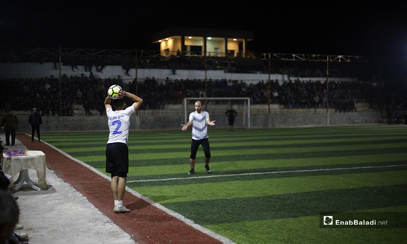 Two players trying to control the ball in the final match of the North Stars League between Deir Hassan and Akrabat teams in Kah area in Idlib – 03 May 2020 (Enab Baladi)
