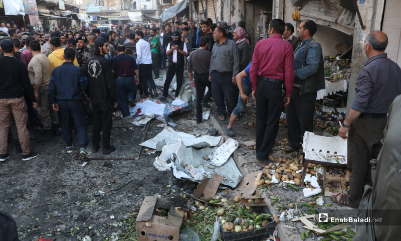 Members of the "Free Police" examining the aftermath of the IED explosion in a vegetable store in al-Raie street of al-Bab city – 10 May 2020 (Enab Baladi)