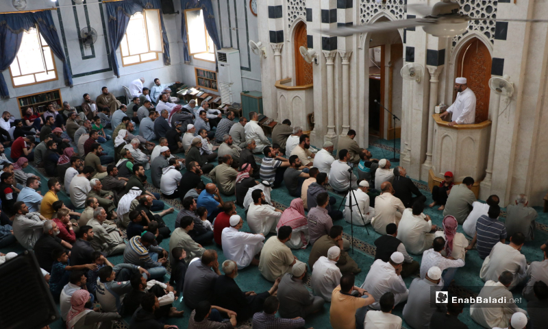 The residents of al-Bab city performing the first communal Friday prayer after lifting the curfew which was part of the measures taken to stem the spread of the novel coronavirus (COVID-19) pandemic – 29 May 2020 (Enab Baladi / Asim Melhem)
