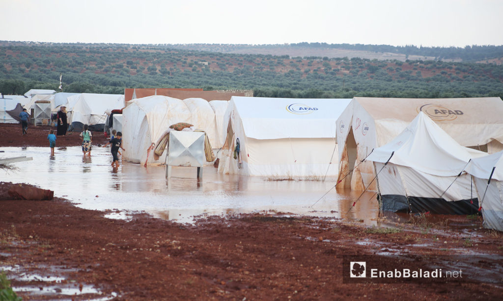 A rainstorm hit the IDPs camps in northern Syria near Kafr Bunni in northern Idlib countryside – 19 June 2020 (Enab Baladi / Yousef Ghuraibi)