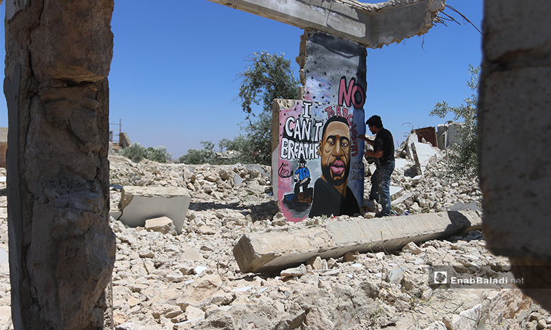 The graffiti artist, Aziz al-Asmar used his brush and colors to express his solidarity with oppressed African-American people on the ruins of his destroyed house’s wall - Yousef Ghuraibi – 01 June 2020