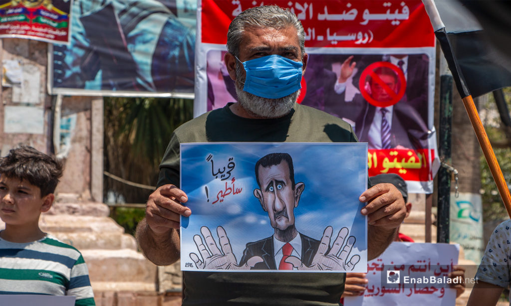 A protest stand in Idlib city’s Clock Square – 10 July 2020 (Enab Baladi / Anas al-Khouli)