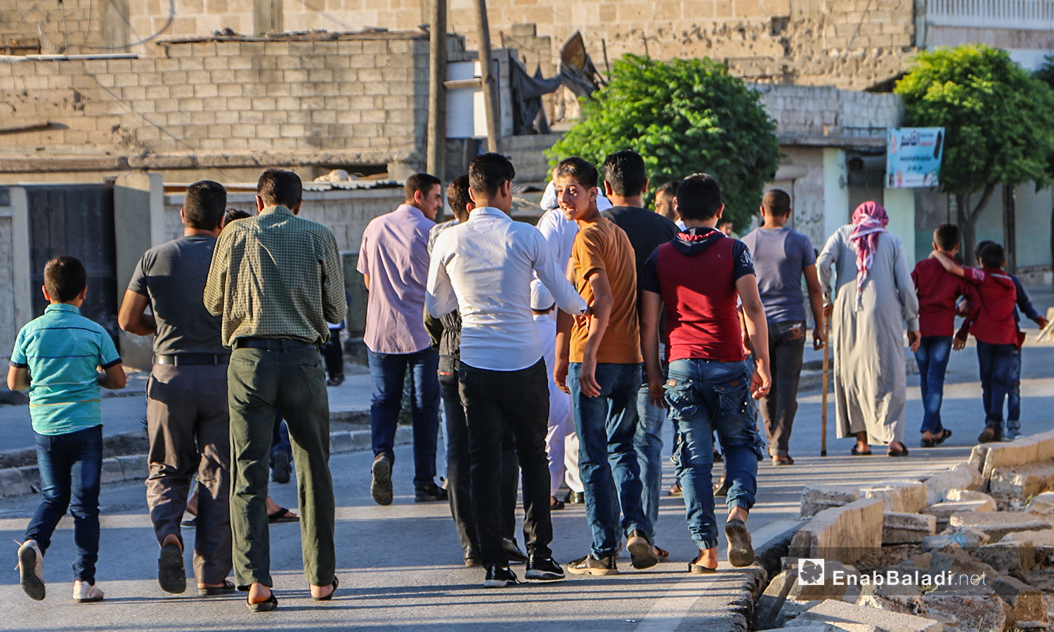 People exiting  a mosque after the end of the Eid al-Adha prayer in Dabiq town in northern Aleppo countryside – 31 July 2020 (Enab Baladi / Abdul Salam Majan)