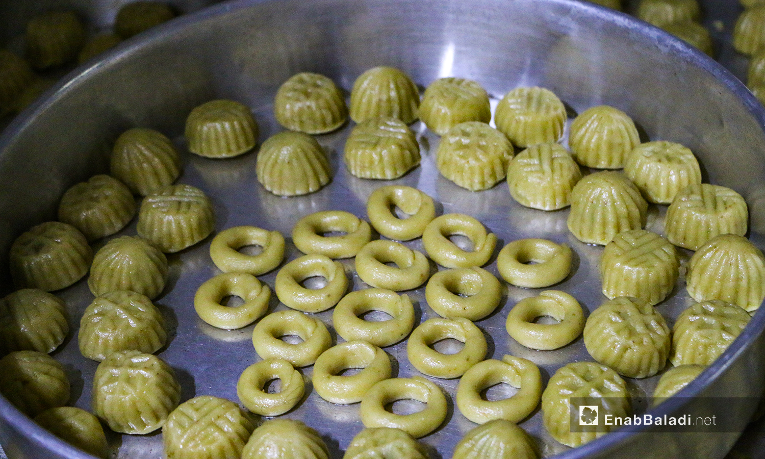 The preparation of home-made traditional Eid sweets in one of Dabiq townhouses in northern Aleppo countryside – 30 July 2020 (Enab Baladi / Abdul Salam Majan)