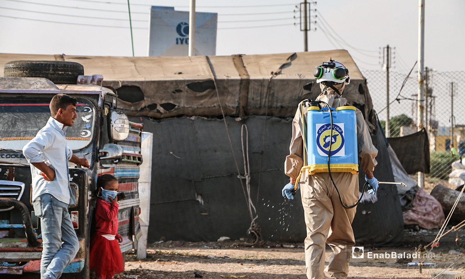 The Syrian Civil Defense team undertakes precautionary measures against the novel coronavirus (COVID-19) pandemic in Dabiq camps for displaced Syrians in northern Aleppo – 12 July 2020 (Enab Baladi / Abdul Salam Majan)
