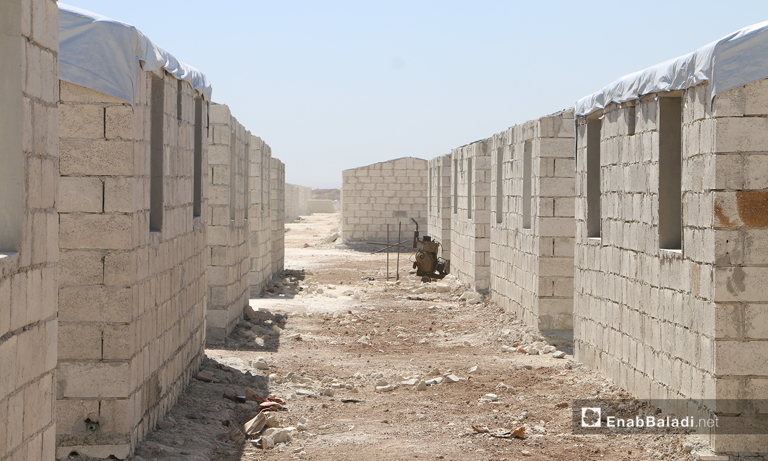The project of establishing concrete housing units to replace the makeshift tents in Bahorta village of northern Aleppo countryside – 26 June 2020 (Enab Baladi / Abdul Salam Majan)