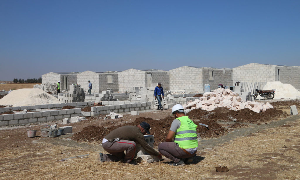 The construction work of housing units to replace the makeshift tents by humanitarian organizations and bodies in northern Syria - 25 June 2020 (the local council Facebook account)