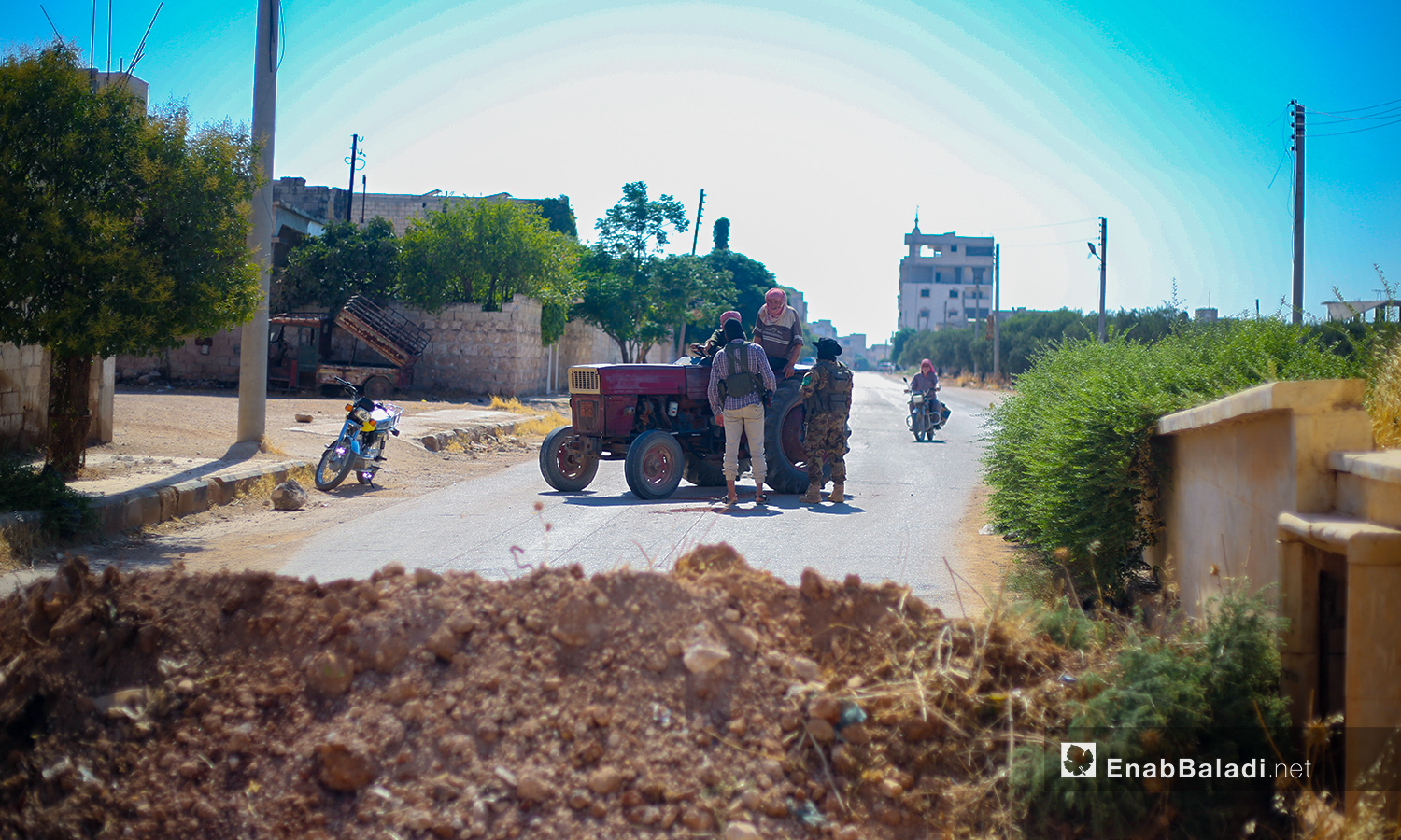 The security forces of the “Syrian Salvation Government (SSG)” close the roads to Sarmin city in Idlib countryside within its procedures to limit the spread of the novel coronavirus (COVID-19) pandemic – 25 July 2020 (Enab Baladi / Yousef Ghuraibi)
