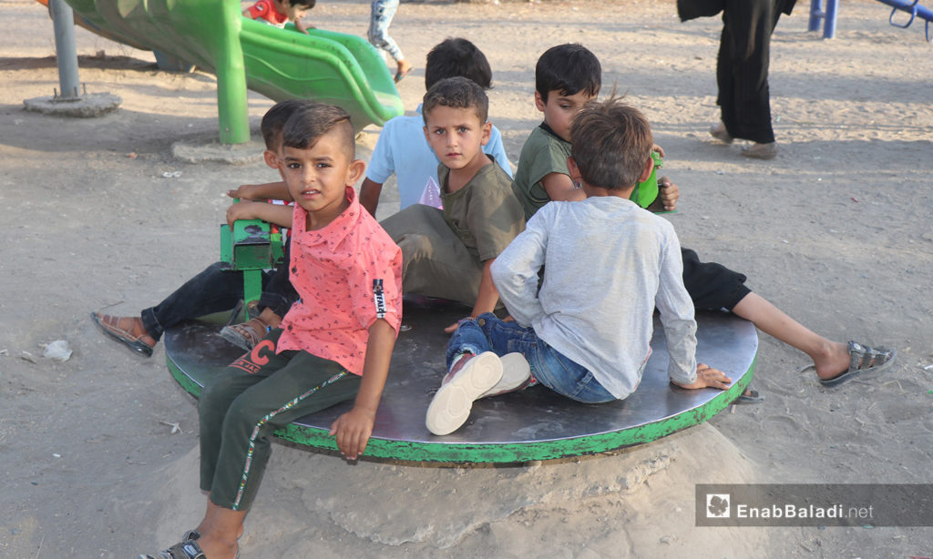 A group of children playing in one of the parks in al-Raqqa city - 26 July 2020 (Enab Baladi / Abdul Aziz Saleh)