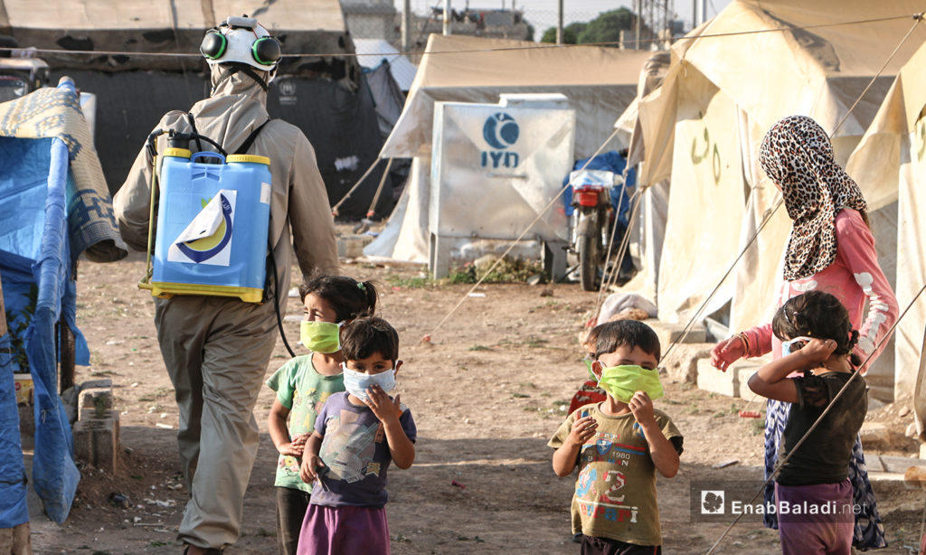 The Syrian Civil Defense team undertakes precautionary measures against the novel coronavirus (COVID-19) pandemic in Dabiq camps in northern Aleppo – 12 July 2020 (Enab Baladi / Abdul Salam Majan)