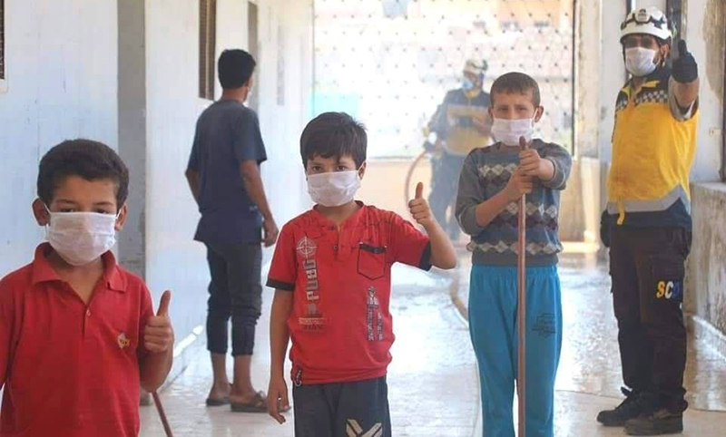 Children in the town of Ihsim in the southern countryside of Idlib are engaged in cleaning the town’s school with the Syrian Civil Defence - 25 September 2020 (Syrian Civil Defence)