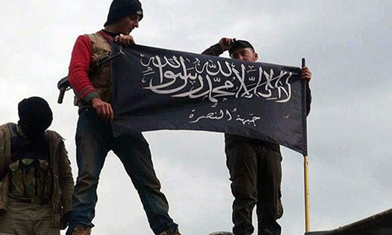 "Jihadists" lifting the al-Nusra Front's flag (AP)