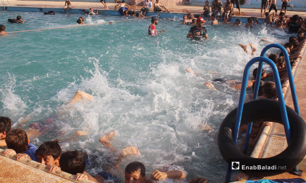 Children practicing swimming in the "al-Iradeh" swimming pool in Killi town in northern Idlib countryside – September 2020 (Enab Baladi / Iyad Abdel Jawad)