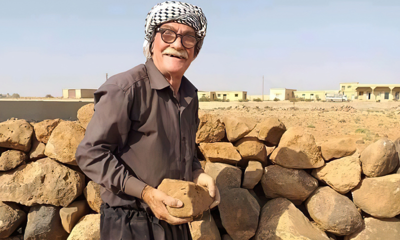 An old man building a wall for his house in As-Suwayda city- 2020 (Suwayda24)