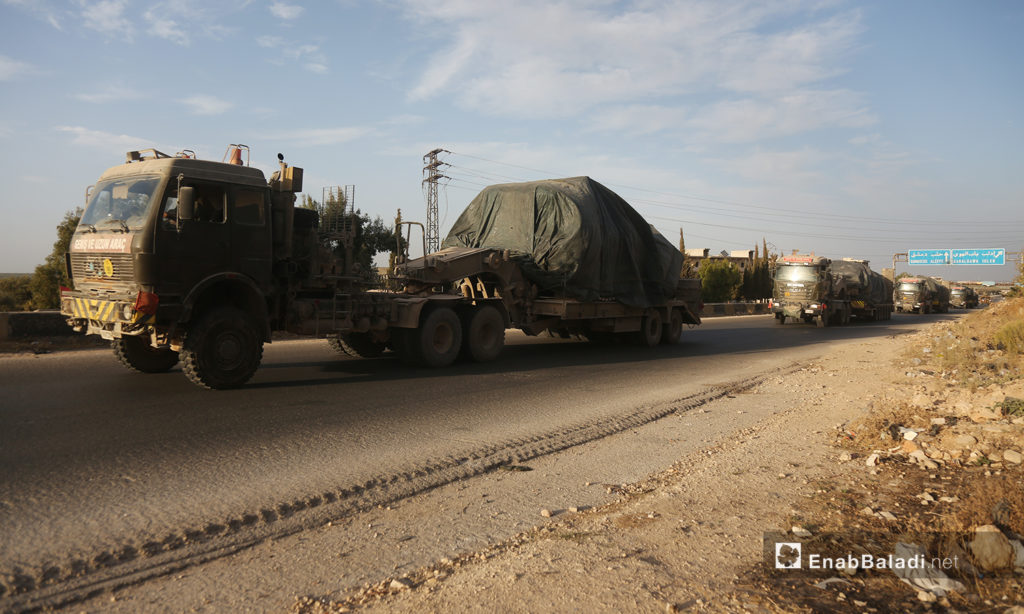 Turkish military vehicles evacuate a military observation post in northern Hama heading to the village of Kokfeen in Jabal al-Zawiya, south of Idlib - 20 October 2020 (Enab Baladi / Yousef Ghuraibi)