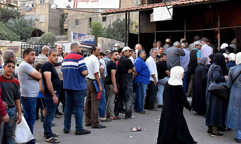 Citizens queuing for government-subsidized bread in the Syrian capital, Damascus - 7 October 2020 (October)