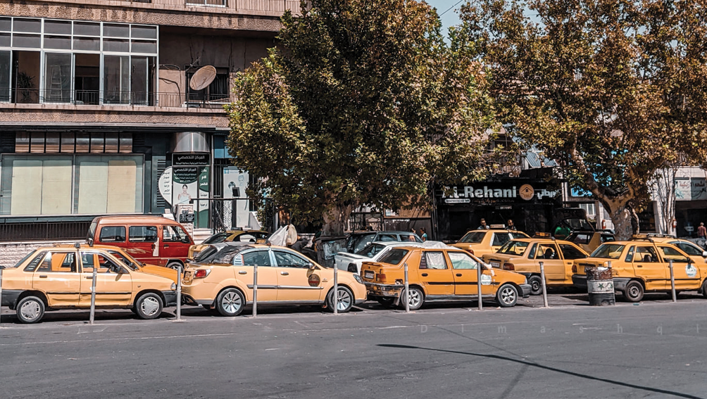 A long line of cars waiting to be re-filled with fuel in front of a fuel station in Damascus - September 2020 (Photo by Lens of a Young Damascene Man)