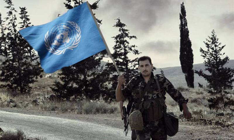 Syrian soldier carrying the UN flag (Designed by Enab Baladi)