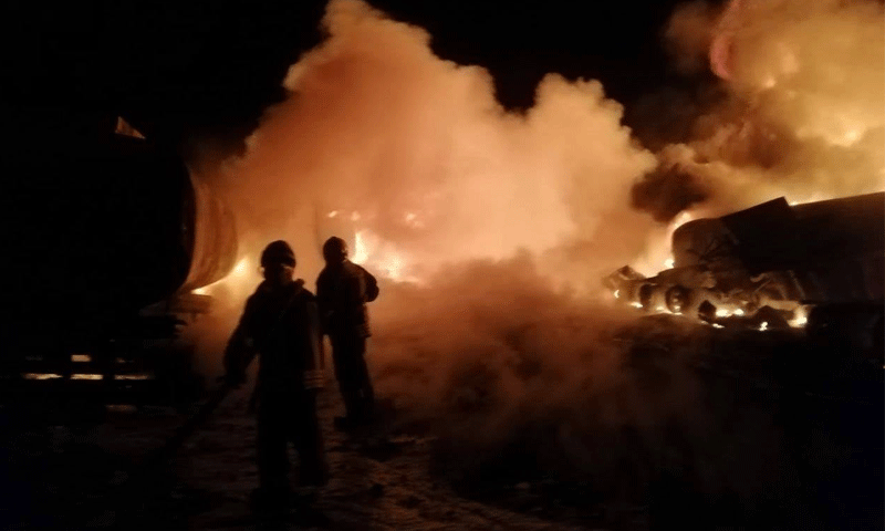 Two Civil Defense volunteers putting fire down following the bombing of the Fuel Market, Jarabulus——23 October 2020 (Civil Defense/Facebook)