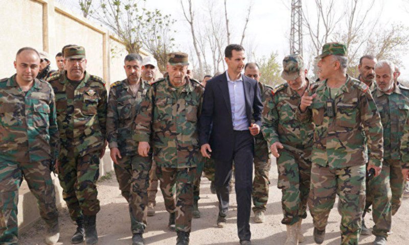 The head of the Syrian regime, Bashar al-Assad, visiting the regime's forces in the countryside of Damascus - 18 March 2018 (SANA)