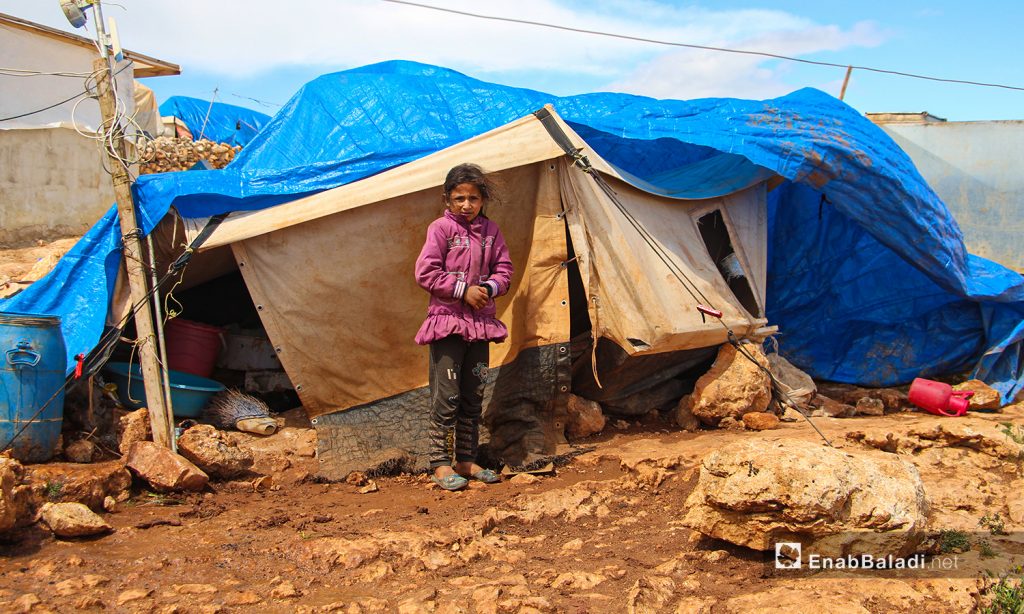 A storm with heavy rain hit the camps for internally displaced people (IDPs) in the northern countryside of Idlib, uprooting the already worn-out tents —24 March 2021 (Enab Baladi / Iyad Abdul Jawad)
