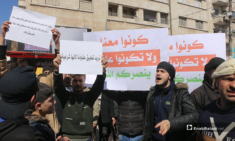 A protest in Idlib city in rejection of the Syrian Salvation Government’s Awqaf Ministry’s decision raising the rents of waqf shops - 06 March 2021 (Enab Baladi / Anas al-Khouli)