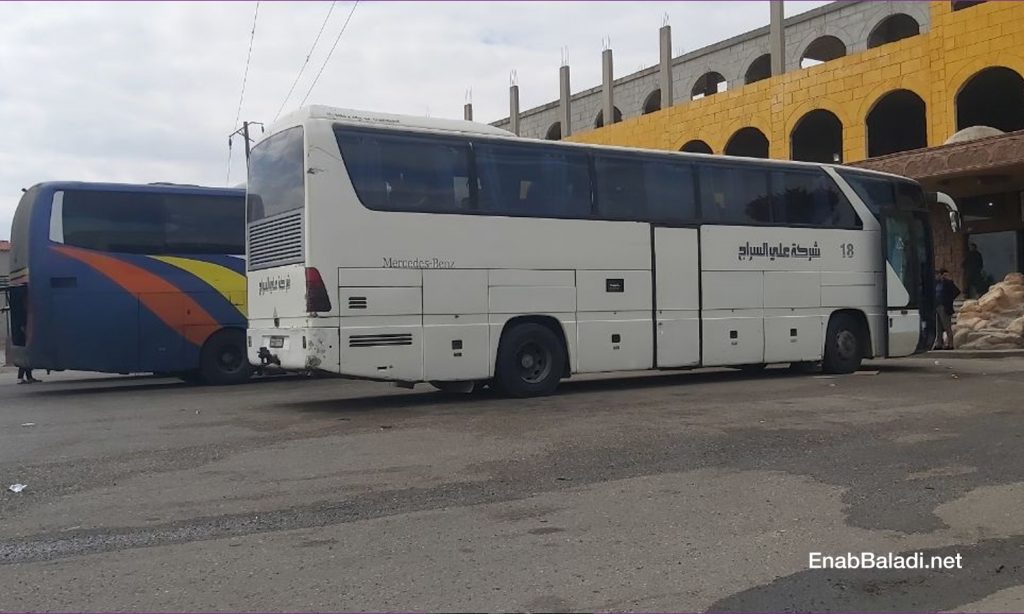 Domestic travel buses on the Homs-Damascus road - 12 April 2021 (Enab Baladi / Urwa al-Mundhir )