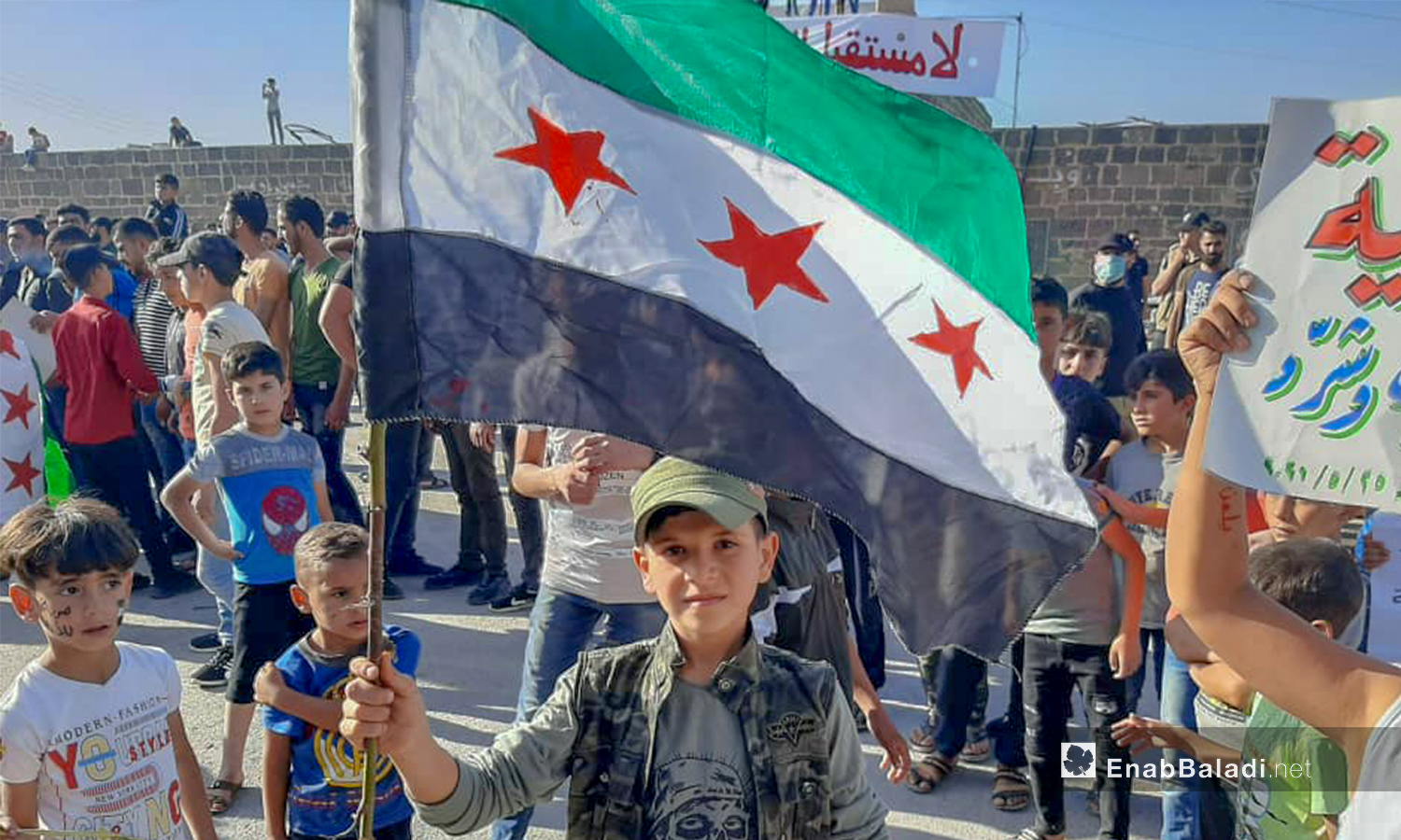 Demonstrators rejecting the presidential elections in the regime-held governorate of Daraa- 25 May 2021 (Enab Baladi- Halim Muhammad)