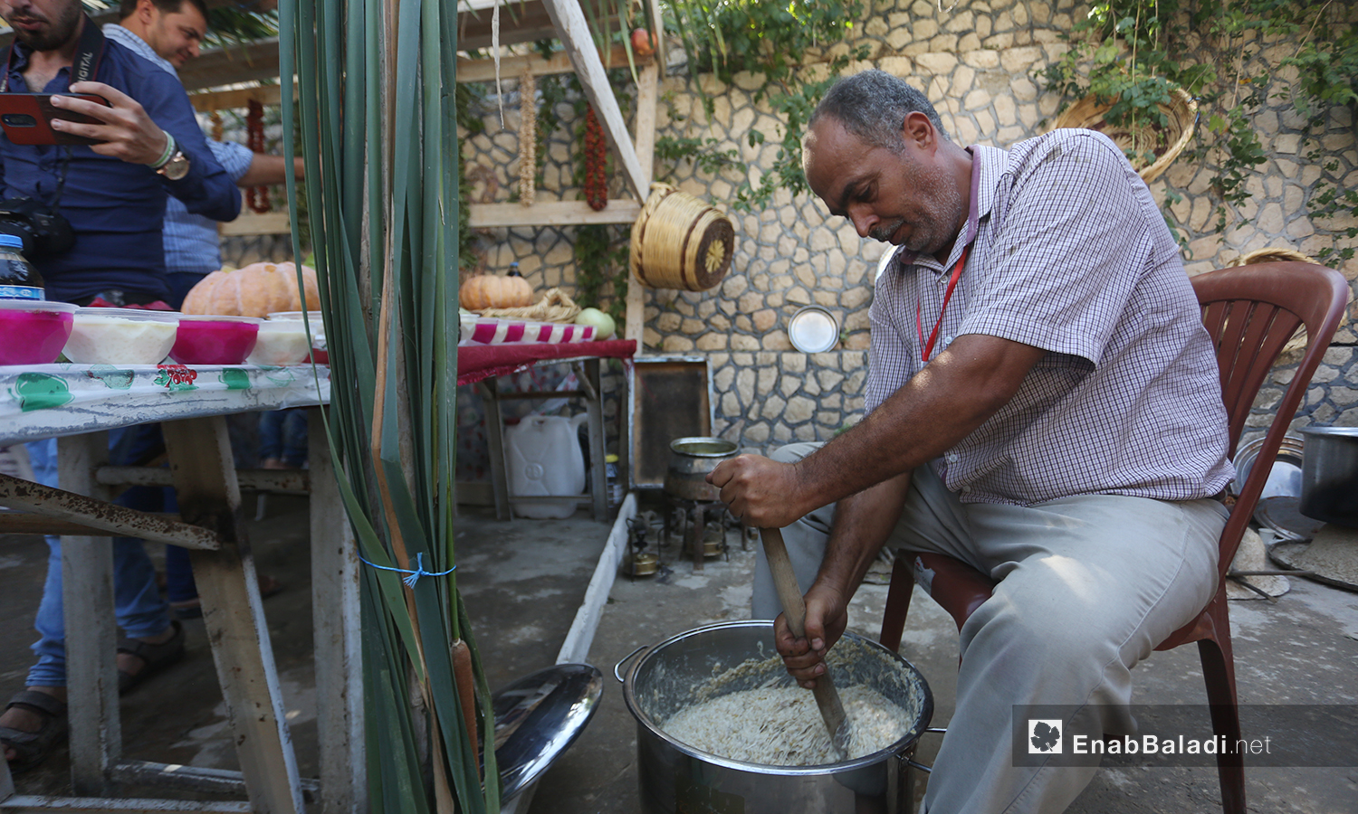 An older man at the third pomegranate festival in Darkoush in the western countryside of Idlib- 5 October 2020 (Enab Baladi-Youssed Gharibi)