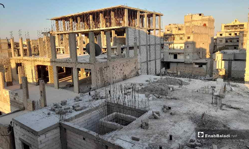 Unfinished multi-story buildings in Raqqa city, northeast Syria - 6 July 2021 (Enab Baladi / Hussam al-Omar)