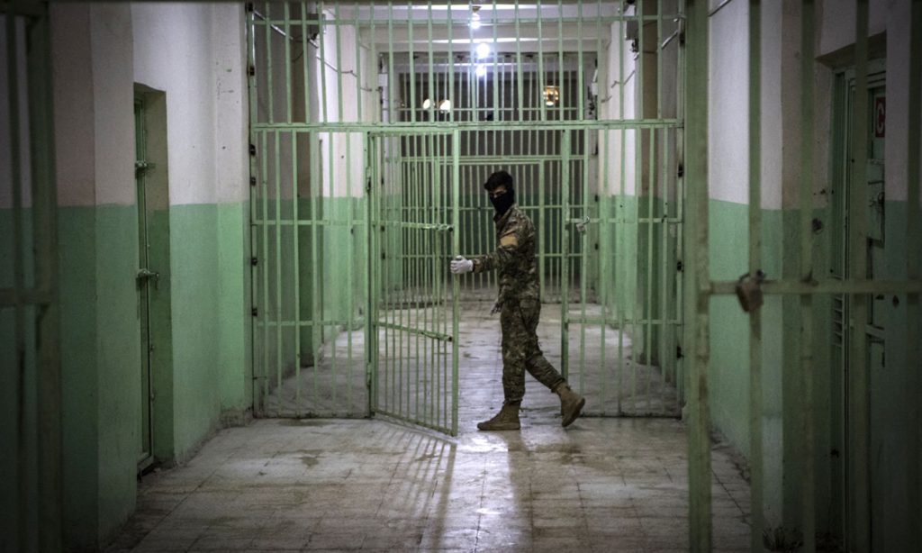 A member of the Syrian Democratic Forces (SDF) serving guard in a prison in al-Hasakah province in northeastern Syria — 29 October 2021 (AFP)