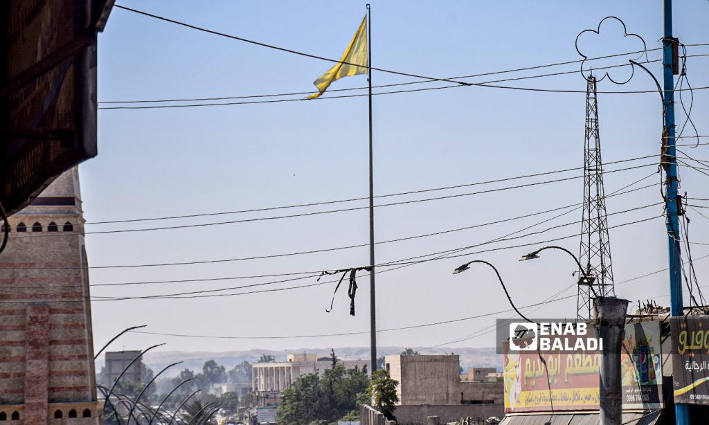 The flag of Raqqa’s Military Council raised in the city of Raqqa - 22 August 2021 (Enab Baladi / Hussam al-Omar)
