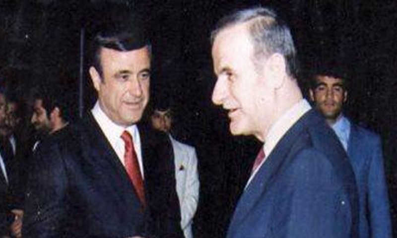 An old photo of Hafez al-Assad and his brother Rifaat in Syria (AFP)
