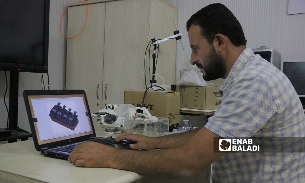 Zakaria al-Khalaf is creating a ventilator, as part of his graduation project at Sham University in Aleppo countryside- 5 October 2021 (Enab Baladi-Walid Othman)