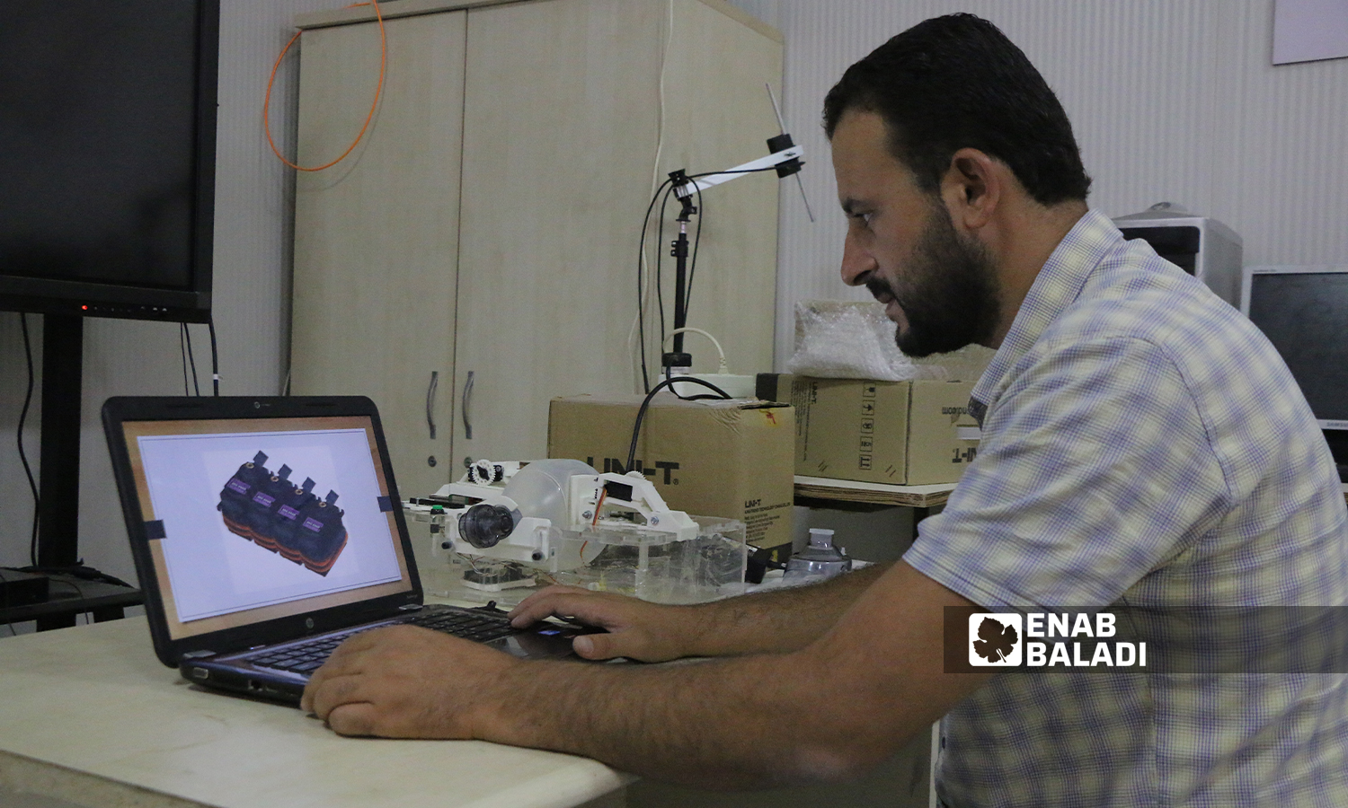 Zakaria al-Khalaf is creating a ventilator, as part of his graduation project at Sham University in Aleppo countryside- 5 October 2021 (Enab Baladi-Walid Othman)
