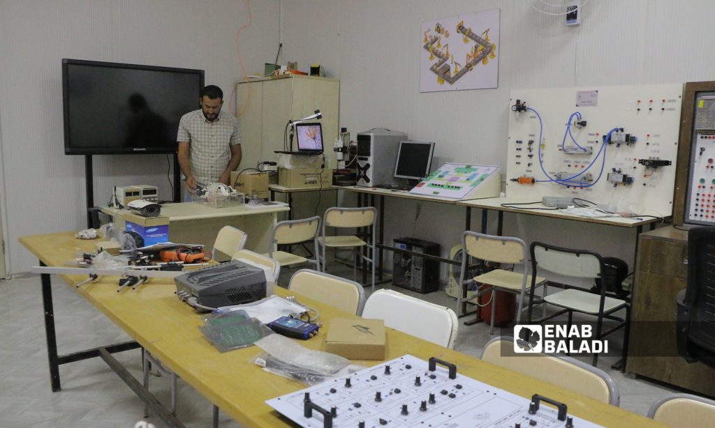 Zakaria al-Khalaf is creating a ventilator, as part of his graduation project at Sham University in Aleppo countryside- 5 October 2021 (Enab Baladi-Walid Othman)