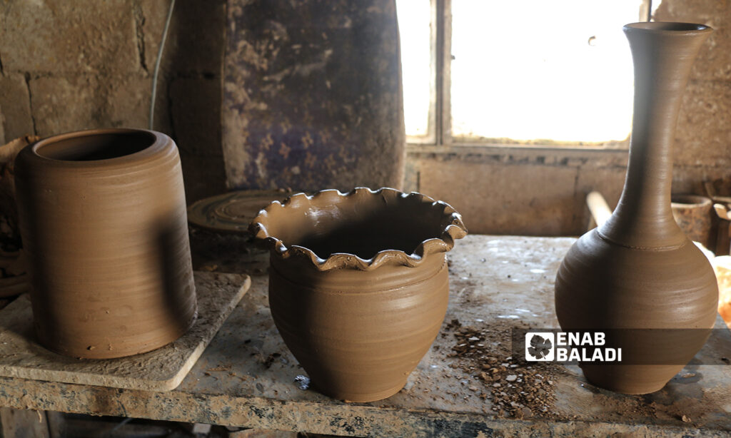 A Syrian potter molding clay pots in Armanaz town, Idlib - 1 February 2022 (Enab Baladi / Iyad Abdul Jawad)