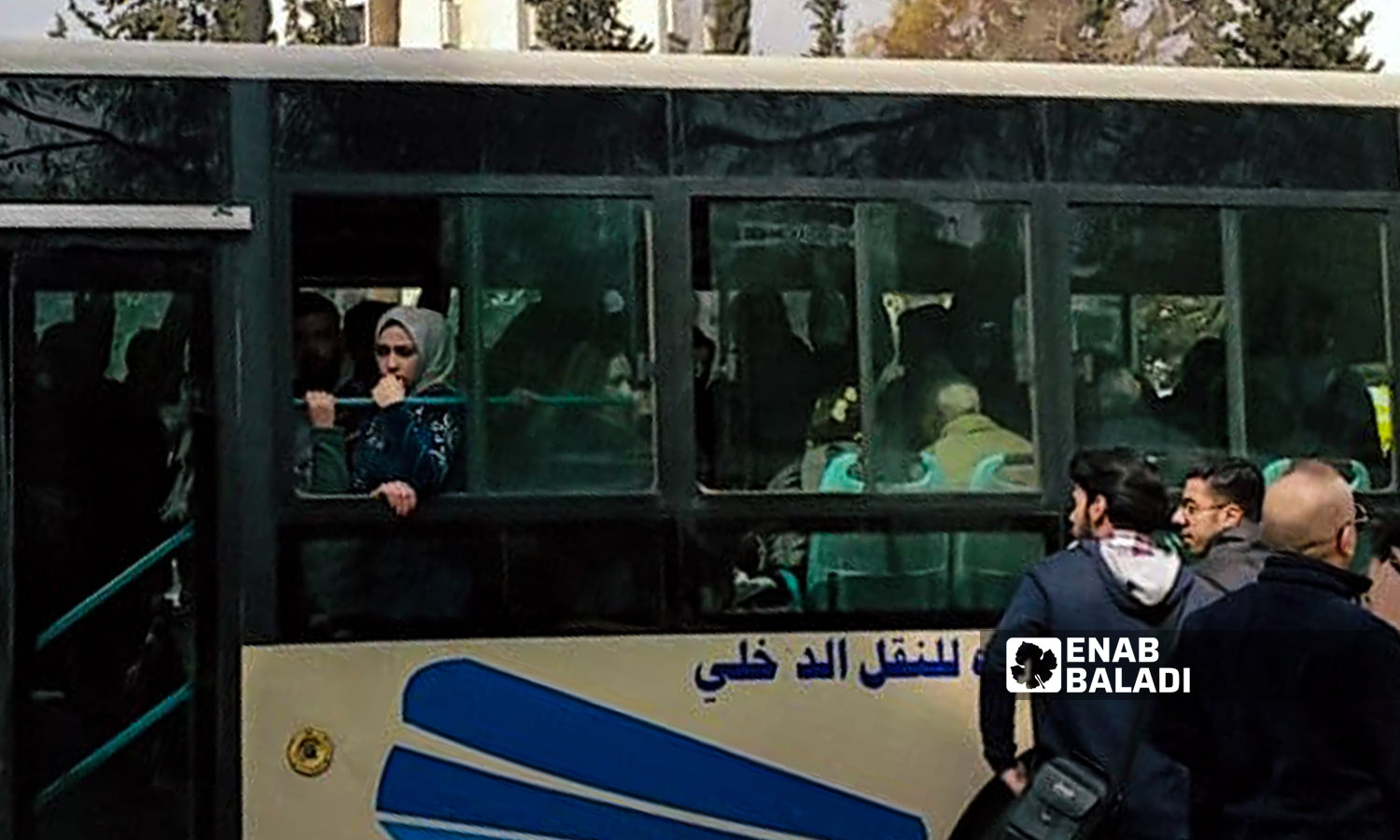Passengers riding a city bus in Damascus -  20 February 2022 (Hassan Hassan / Enab Baladi)