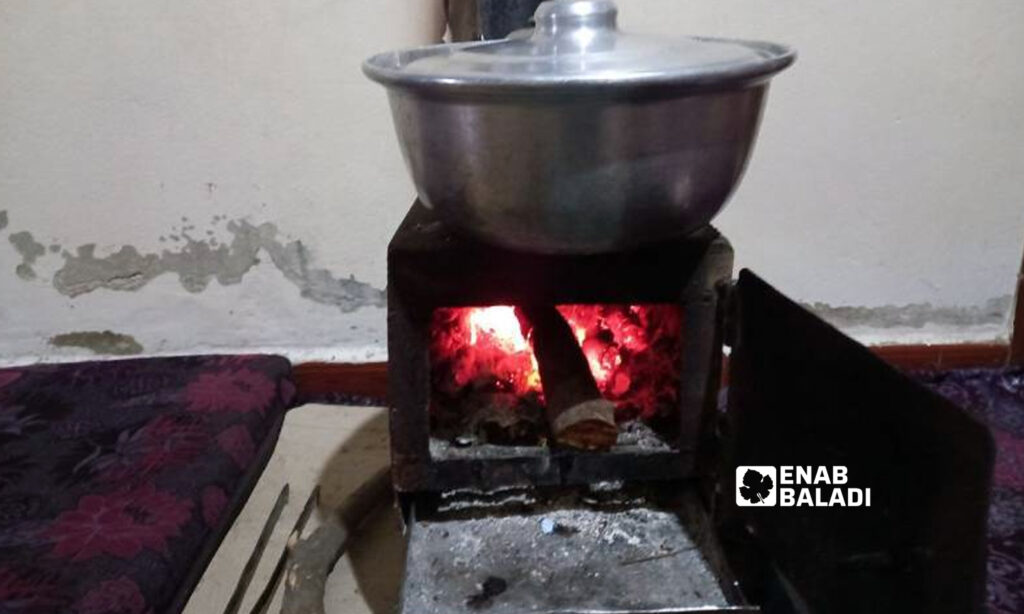 A pot of fava beans cooked on a wood-burning heater in the western countryside of Daraa - 14 February 2022 (Enab Baladi/Halim Muhammad)