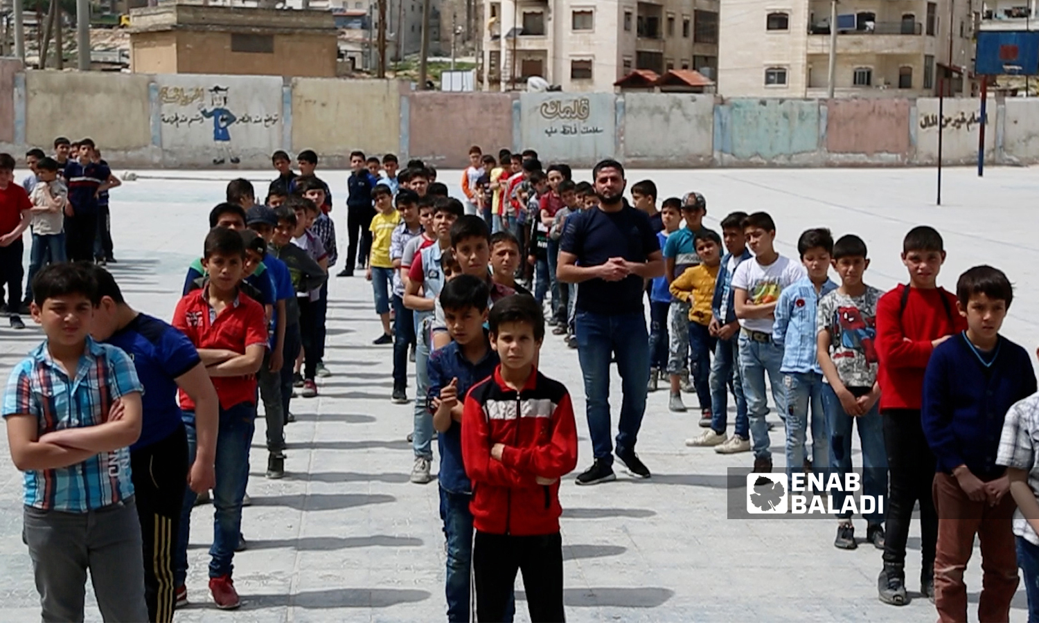 Students lining up in a schoolyard in Idlib city - 21 April 2021 (Enab Baladi)
