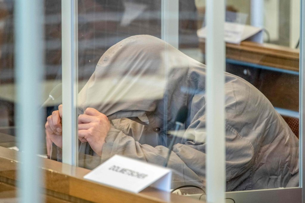 Eyad al-Gharib hides himself under his hood in court in Koblenz, western Germany - 4 June 2020. AFP - Thomas Lohnes 