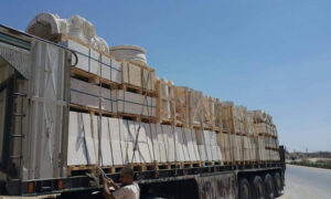 Trucks carrying Aleppo stone cargo on the Armanaz road in northern Syria - 23 June 2021 (Al-Waleed for Aleppo Stone Facebook page)