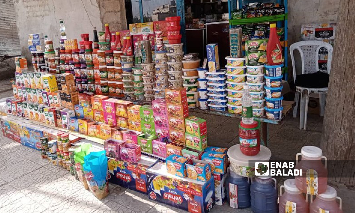 Products and consumer goods displayed in front of a store in southern Daraa city - 26 May 2022 (Enab Baladi / Halim Muhammad)