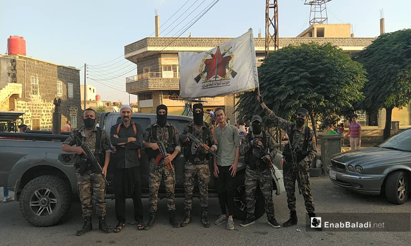 A group of the Anti-Terrorism Force faction in As-Suwayda accompanied by a young man who was freed from kidnapping - 23 July 2021 (Enab Baladi)