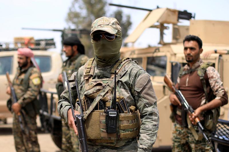 A group of the US-led SDF fighters in the eastern Deir Ezzor governorate - 1 May 2018 (Reuters)