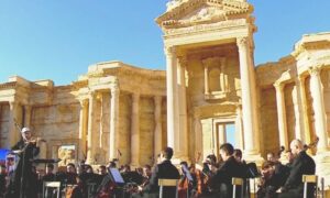 A Russian orchestra playing in the ruins of the tourist city of Palmyra in 2016 (AP)