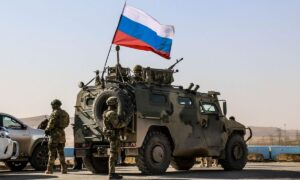 Russian forces cross the road between the towns of Tal Tamr and Ain Issa in northeastern Syria (North Press Agency)