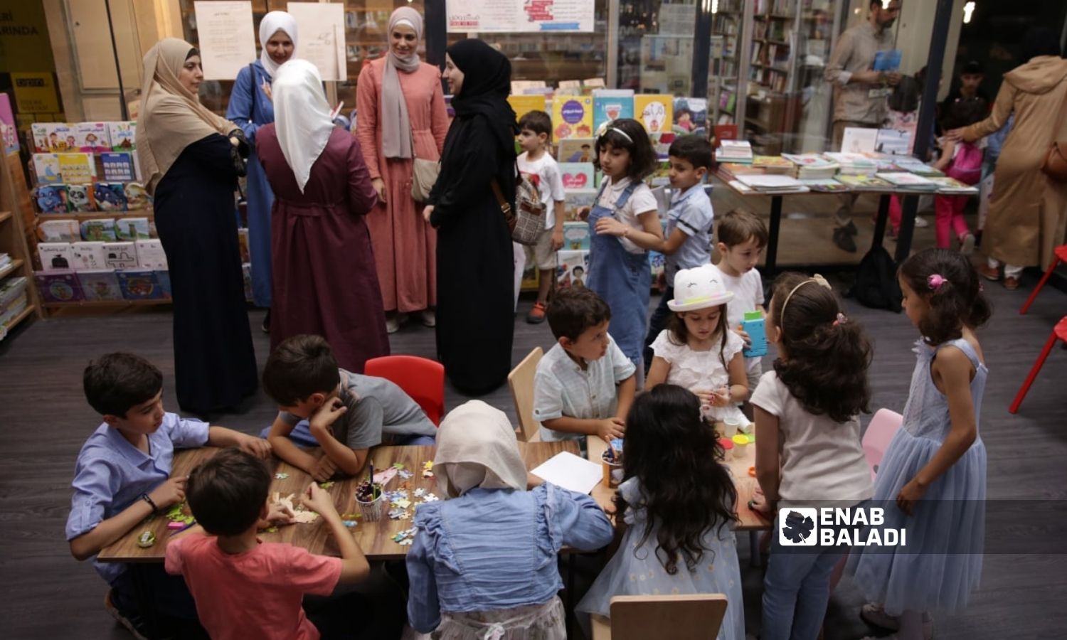 Children practice in group activities during the “Let’s Tell a Story” event - 5 August 2022 (Enab Baladi/Yousef Humms)