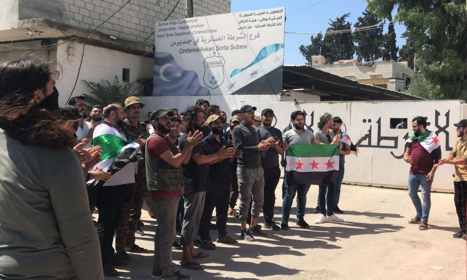 Protesters standing in front of the military police headquarters in Jindires, calling for the release of media activist Louay Younis - 8 August 2022 (Revolution Activists Association in Homs / Twitter)