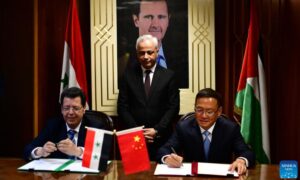Chinese Ambassador to Syria, Feng Biao, Syrian Minister of Communications Iyad al-Khatib, and head of the Syrian Planning and International Cooperation Commission (PICC), Fadi al-Khalil, during the signing ceremony of an aid agreement in Damascus - 20 July 2022 (Xinhua)